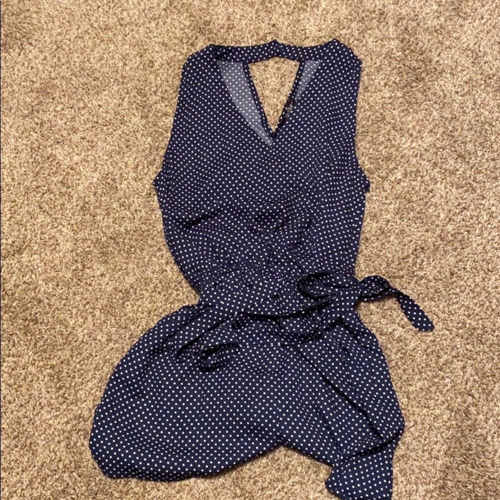 Navy and white polka dot romper with tie belt